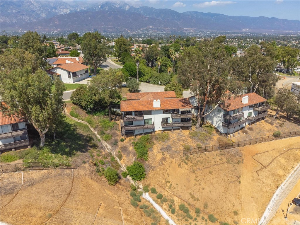This is a rare opportunity to own this beautiful Red Hill, completely remodeled condo. No expense has been spared from the moment you walk in. You will see the exquisite $30k hardwood flooring to the WOLF chefs oven, hickory cabinets throughout and sandstone countertops. The location of this unit is one of the best in the community perched high with 2 balconies, one off the living room and one off the primary bedroom and 3rd bedroom. The city light views at night are breathtaking to say the least! This home features a huge living/dining area that is great for entertaining, beamed ceilings, a beautiful oversized fireplase with a stone hearth. This home has 3 bedrooms and 3 full bathrooms, 1 bedroom and 1 bathroom are on the main floor, good for overnight guests. The primary suite has a large walk-in closet with custom built-ins and a beautiful primary bathroom with ample storage space. The 3 car garage is a man-cave dream with a sink, TV and ceiling fans.