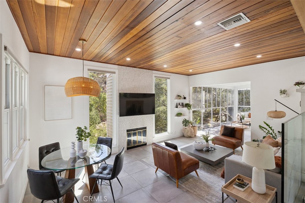 What happens when you combine nature, privacy, & city convenience? You get this one-of-a-kind Box Canyon home where you’ll feel like you’ve escaped to the mountains surrounded by oak trees. This isn’t just another updated mid-century—it’s a private retreat tucked into nature with city access at your doorstep. This custom home boasts 2,830 sq. ft. with three bedrooms, three bathrooms, & an inviting open floor plan that welcomes you in the moment the door opens. Two gated entrances service the property along with solar panels, plus a guest unit (ADU) with its own separate entrance perfect as a studio/workspace/ rental, or for all the guests you’ll have who want to share this home’s peace & tranquility. The bright & open-concept layout graciously incorporates a remodeled kitchen with chic white quartz countertops with Italian tile backsplash, a breakfast bar, & stainless appliance. Steps away is the dining area, family room with high ceilings & fireplace, & sunroom all allowing you to soak in the vast pristine nature views. The flooring throughout is an elegant blend of porcelain concrete tile with Italian white oak wood floors imported from Europe. The primary suite is another haven within itself, including a walk-in closet, a remodeled bathroom with white quartz countertops, & of course more windows allowing nature’s light to fill the space. Just off the primary is a balcony allowing your mornings to start with mountain views & your nights to end under starlit skies. Surrounded by a multitude of hiking trails, this property backs onto a nature preserve allowing you to experience peace, views, & convenience all in one place. You have the space, nature, & peace, you deserve without giving up convenience. Come enjoy your private retreat—just minutes away, yet a world apart.