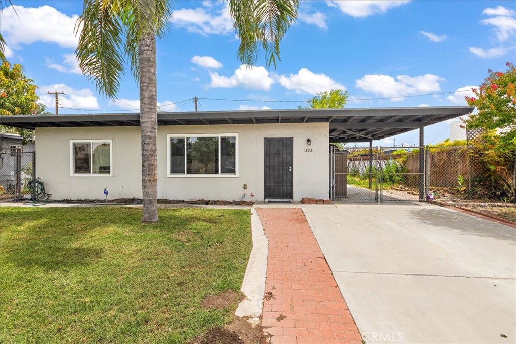 Welcome to this inviting 3 bedroom, 1 bathroom home, offering comfort, convenience, and a spacious outdoor setting. Nestled in the heart of Colton. Step inside to an open-concept living room, seamlessly flowing into a functional galley-style kitchen with washer and dryer hookups for added convenience. Each bedroom is generously sized, providing a comfortable retreat. Outside, you'll find a large carport ideal for multiple vehicles and a spacious backyard, perfect for entertaining, gardening, or expanding your outdoor living space. A front iron fence adds an extra touch of privacy. This home is a fantastic opportunity. Schedule a showing today!