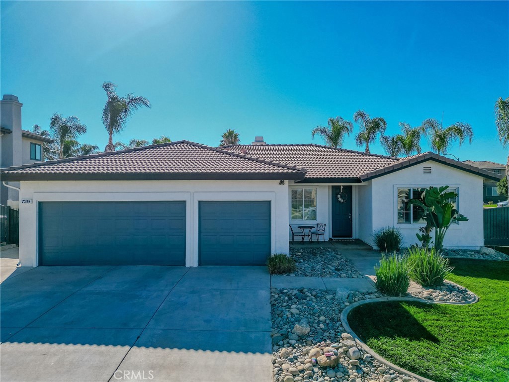 Welcome to 729 Windbound Ave., a stunning home that looks straight out of a MODEL SHOWCASE, but with NO HOA and LOW TAXES, a rare find in the city of Beaumont! From the moment you arrive, you’ll be impressed by the gorgeous curb appeal, lush landscaping, and a spotless garage with epoxy flooring.
Step inside to discover beautiful TILE FLOORING, PLANTATION SHUTTERS throughout, and soft, neutral paint that creates a warm and inviting feel. When you enter the beautiful, airy formal living and dining rooms, you will immediately feel the pride in this home and notice the lovely crown molding. The upgraded kitchen features QUARTZ COUNTERT-TOPS, stylish cabinetry, LARGE ISLAND and plenty of space for cooking and entertaining. The FIREPLACE with designer tile adds an elegant touch to the living area.
Each bedroom offers brand-new carpet, and both bathrooms have been thoughtfully upgraded with lovely cabinetry and modern lighting. The primary suite is spacious and serene, the perfect retreat after a long day. The primary suite features a stylish barn door leading to a beautifully upgraded bathroom with double sinks, new lighting, and a spacious walk-in closet.
Step outside to your private backyard oasis! Enjoy a covered PATIO with ceiling fans, above-ground SPA, GAS FIRE PIT, RV PARKING and a large STUCCO SHED that’s perfect for storage or could easily be converted into additional living space.
This home truly has it all...style, comfort, a WHOLE HOUSE FAN and unbeatable value. Don’t miss the opportunity to own this beautiful Beaumont gem where pride of ownership shines throughout!