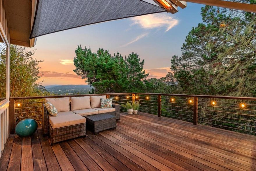 This mid-century modern home is an entertainer's paradise. Emanating Hollywood Hills vibes, the property looks out over the canyon, with peeks of the Bay. Even before you enter the home, the moody covered walkway draws you into an immersive experience - something different and welcomed. Private, and designed as a sanctuary for both homebodies and social butterflies, alike, you won't find another like it in the wild. The chef's kitchen opens to both the living area and view deck, where you'll find an automatic sunshade, a built-in heat register, and Brazilian hardwood, all thoughtfully placed with the user's experience in mind. Offering 3 beds, an ensuite primary, and 2 full, remodeled baths, the bedroom area separates well from the communal. There is a full-size laundry room, streamlined and versatile, as well as a very usable bonus area could be use as a gym or office and workshop, below the house, neither of which are counted in the square footage. There is also a second, lower level deck, and a separate patio area, offering many choices of private outdoor spaces, from which to enjoy this incredible Monterey haven.