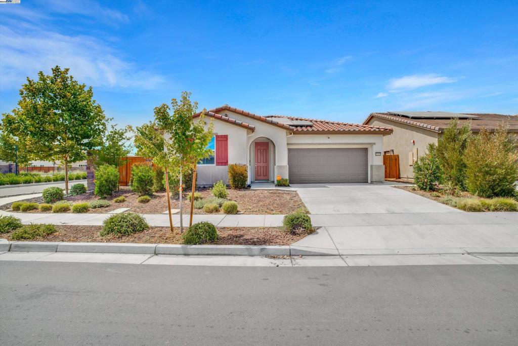 Welcome to 15455 Folktale Way, Lathrop — a beautifully maintained single-story home located in the highly desired Stanford Crossings community, built in 2022. This 3-bedroom, 2-bath home sits on a premium corner lot with no backyard neighbors for added privacy. The kitchen features granite countertops, white cabinetry, and stainless steel appliances. Enjoy a finished backyard ideal for relaxing or entertaining. Designed for energy efficiency and peace of mind, the home includes 30 solar panels and 2 Tesla battery packs — say goodbye to high energy bills and blackout worries. Conveniently located near parks, trails, restaurants, retail, and the San Joaquin River, with quick access to I-5, 120, and 205 freeways. A perfect blend of comfort, convenience, and sustainability — don’t miss this one!