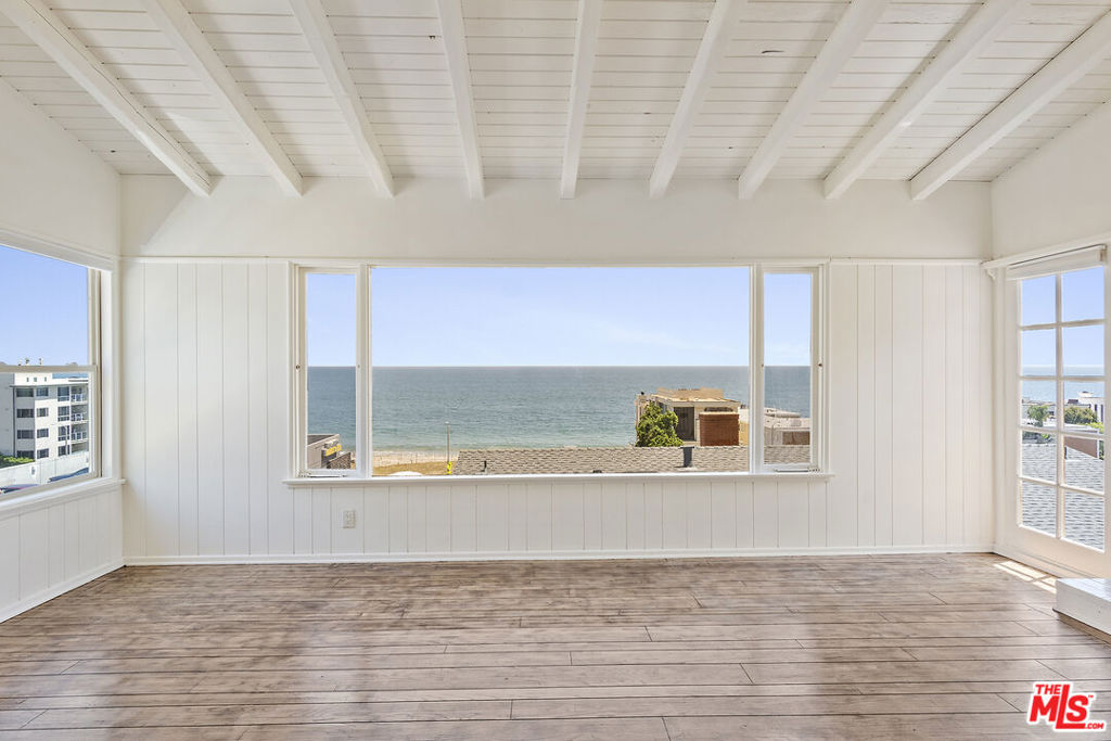 Inquire about move in special. Live the ultimate Malibu Beach lifestyle in this charming coastal home, perfectly perched above the prestigious Carbon Beach. Offering breathtaking panoramic ocean views, this residence showcases whitewater vistas stretching from the Malibu Pier and Catalina Island to the Santa Monica Bay. Step onto the expansive ocean-facing deck and take in the unparalleled sunrise and sunset views, with the soothing sound of crashing waves as your daily backdrop. Inside, the home features an updated kitchen and bathroom, stainless steel appliances, and a versatile storage loft for added convenience. The open-concept living space is light and bright, accentuated by high-beamed ceilings and a cozy gas fireplace, creating a warm yet airy ambiance. Central A/C & heat ensure year-round comfort. Enjoy easy beach access and proximity to Malibu's top-tier dining and shopping. You're just minutes from Nobu, SOHO House, V's, Malibu Farm, and Taverna Tony, as well as Malibu Country Mart, The Malibu Lumberyard, and Whole Foods. With its unbeatable location and mesmerizing ocean views, this Malibu retreat is the perfect place to call home.