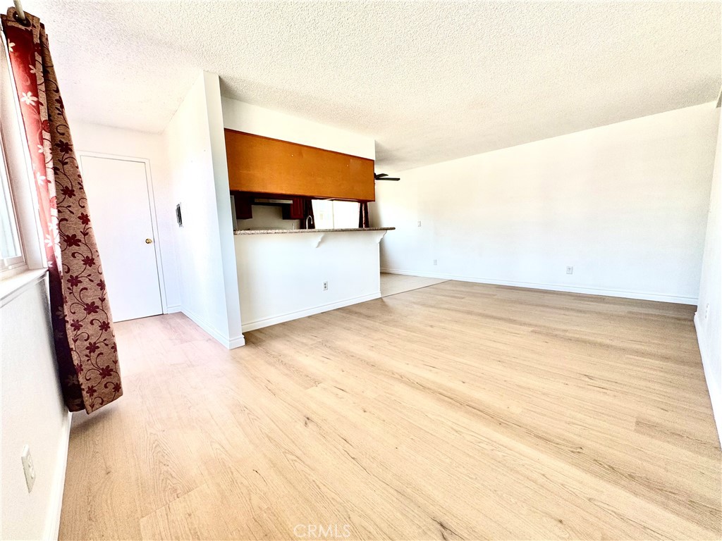Great location! This newly renovated 2-bedroom, 1-bathroom apartment features brand new hardwood floors, freshly painted walls, and an open-plan living area filled with natural light from large windows. Enjoy convenient access to restaurants, grocery stores like: Costco, Target, Walgreens, shopping mall, schools, and parks. Along with easy access to the 605 freeway. The apartment includes a shared laundry room for four units and access to a community swimming pool. This pet-friendly apartment offers both comfort and convenience.