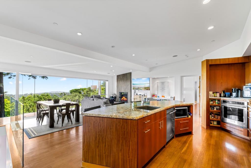 Perched upon one of Carmel Woods amazing ocean view lots, stands this exceptional highly desirable home. Designed by renowned Carmel architect Erik Dyar, its unique contemporary style maximizes the impact of profound sweeping ocean views. Floor to ceiling windows frame the open plan great room where kitchen, dining and entertaining spaces all enjoy the surrounding forest, Carmel Bay and beyond. This also creates a feeling of floating amongst the forest while custom cabinets blend in like fine custom furniture and striking stone features add even greater beauty. The home boasts a master suite with fireplace, balcony and luxurious bath, a 2nd bedroom or office upstairs, a family room with fireplace and 3rd bed/bath downstairs. A large deck, private fully fenced yard and hot tub create the perfect destination to enjoy. You wont be disappointed by this truly one-of-a-kind, extraordinary home with stunning ocean views, views, views from every room - theres nothing else like it!