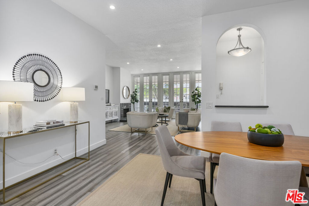 Prime location in the heart of Beverly Hills! Beautifully updated and spacious 2 bed/1.75 bath + DEN/OFFICE in desired smaller 7 unit complex. Open floor plan and high ceilings includes living room with wall of windows and french doors opening to front facing charming brick patio overlooking Century City City light views. Step up den/office (could be used as a 3rd bedroom) with french doors, newer cabinetry including wardrobe closets and remodeled en-suite full bathroom with quartz and tile finishes. Large dining room opens to totally updated sun-filled kitchen with quartz countertops, newer cabinetry with pull out drawers, stainless steel appliances and breakfast room opening to 2nd private patio area. Primary suite with wall of custom built closets and beautifully updated bathroom with dual basins, built-in linen cabinets and large tiled shower. 2nd bedroom with closet and double door entry. Additional features include LED recessed lighting throughout, central ac/heat, contemporary laminate flooring and newly carpeted bedrooms. Pets ok, 2 SIDE X SIDE PARKING SPACES with extra storage. Close proximity to Westfield Century City Mall, Roxbury Park and Beverly Hills world class restaurants and retail. Move-in ready!