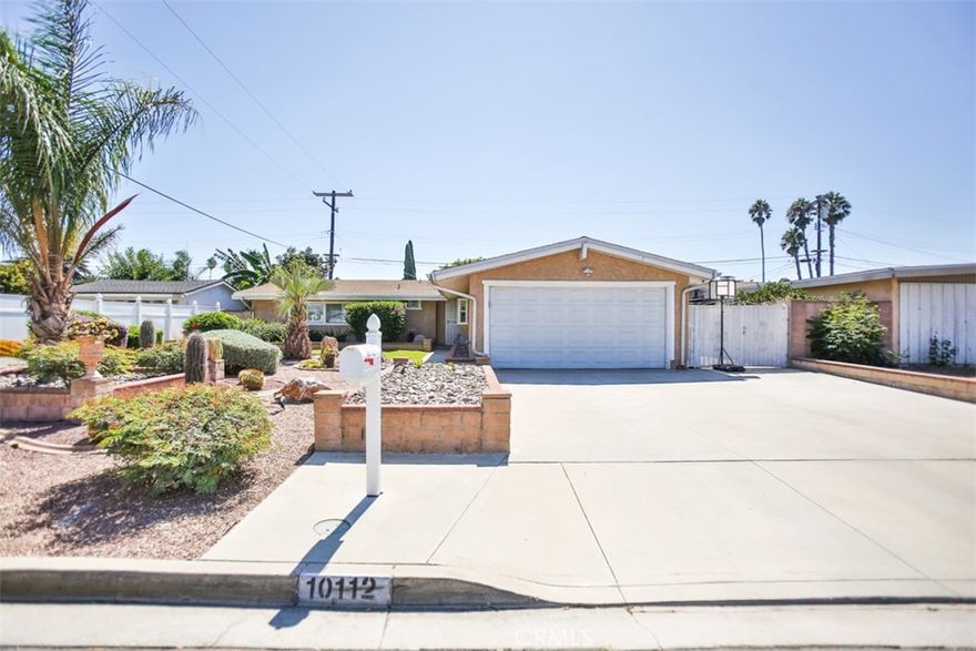 Welcome to 10112 Becca Drive, a single-story ranch home in Garden Grove that seamlessly combines midcentury charm with modern convenience. Offering 4 bedrooms and 2 bathrooms across approximately 1,852 sq. ft., this thoughtfully expanded residence showcases beamed ceilings, dual-pane windows, a cozy fireplace, and an open layout with a dedicated family room.

The kitchen is designed for function and comfort, featuring a walk-in pantry and generous counter space. Outdoors, enjoy a spacious covered patio, a lush wrap-around yard with fruit trees, a gated side yard, and convenient RV or extra vehicle parking.

Set on a 7,200 sq. ft. lot within the Garden Grove Unified School District, this home is ideally located just minutes from shopping, parks, freeways, and the enchantment of Disneyland. A timeless ranch classic—rarely available and ready to be enjoyed.