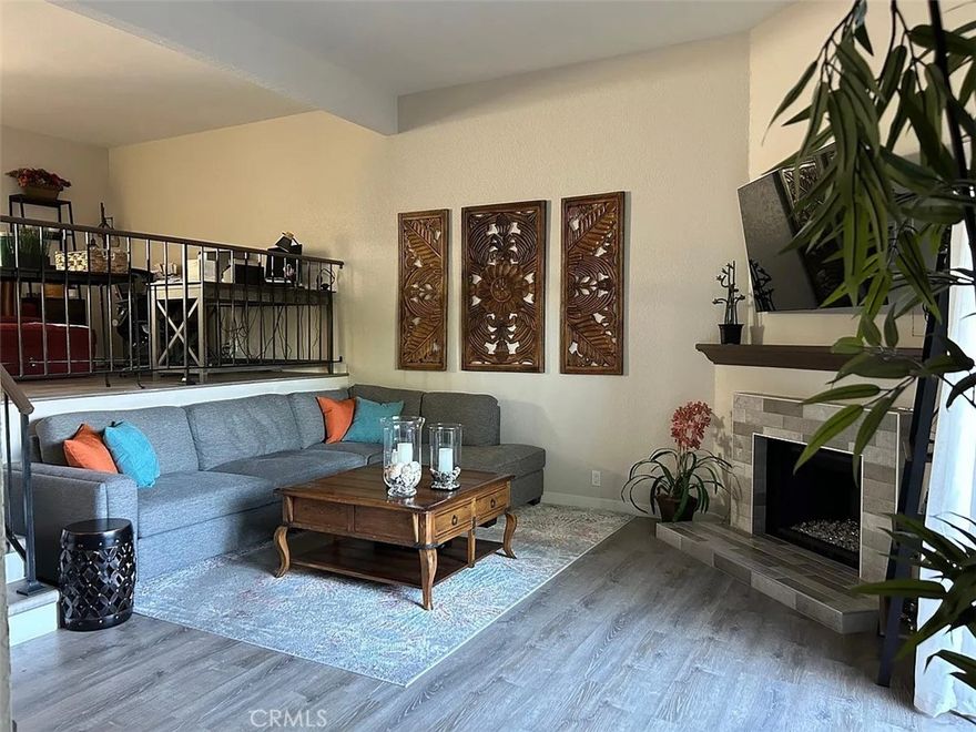 Welcome to this three-story townhouse that combines modern style with everyday ease. The first level features a cozy living room with a fireplace that opens to a private patio—ideal for barbecues or relaxed evenings with friends. Upstairs, the second floor offers the heart of the home with an updated kitchen, dining area, and a convenient half bath, plus a flexible nook perfect for a home office or reading corner. The top floor boasts two spacious primary suites, each with its own en-suite bathroom. One includes mirrored closet doors and a private balcony, while the other features a generous walk-in closet, creating a wonderful sense of privacy and comfort. Additional highlights include an attached two-car garage, in-unit washer and dryer, and all appliances included. Move-in ready and thoughtfully updated, this home is moments from The Triangle, grocery stores, and just 2.5 miles to the beach—an ideal location for both everyday living and entertainment.