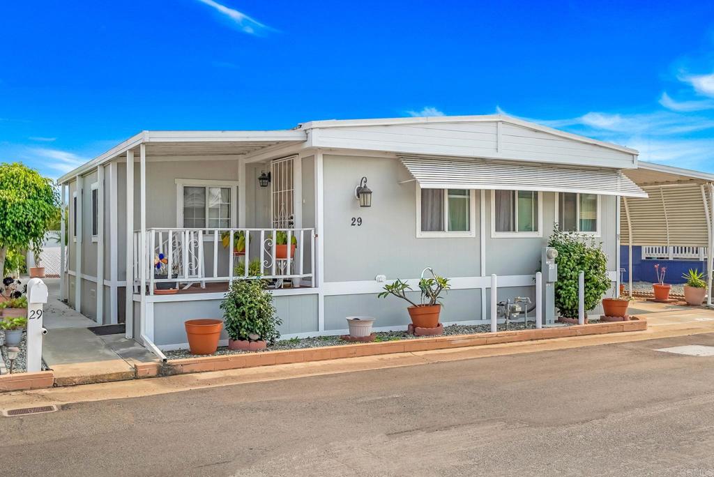 GREAT OPPORTUNITY!! Charming Remodeled Manufactured Home in a 55+ Community – Chula Vista. WELCOME to this beautifully remodeled 2-bedroom, 2-bath home located in the heart of Chula Vista! This cozy and stylish residence features: Real wood flooring in the living room, dining room, kitchen, and hallway. Updated kitchen with granite countertops. Spacious primary bedroom with en-suite bathroom with tile flooring and convenient walk-in shower. Relaxing tub in the guest/hall bathroom with tile flooring. Additional sunroom. Private shed for extra storage in the back patio. Energy-efficient tankless water heater. Heated community pool (May–October). Large clubhouse with tables and chairs—ideal for meetings and private gatherings at no cost to owners. This peaceful and well-maintained 55+ community is centrally located near shopping malls, fast food, supermarkets, trolley station, and more! Important: All buyers must be approved by the park. Don't miss out on this fantastic opportunity to enjoy comfort, convenience, and community living!