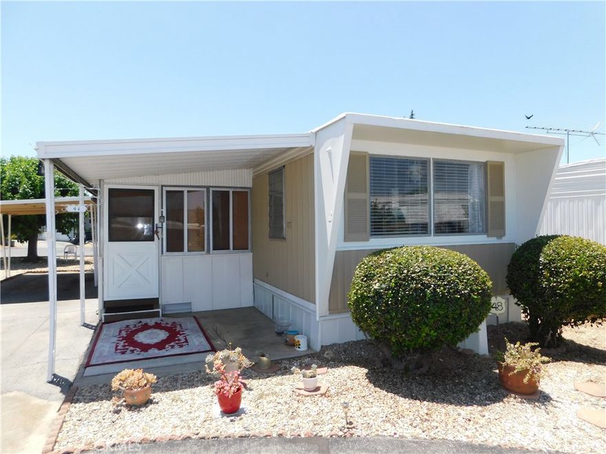 ~Beautiful home, situated at the end of a cul-de-sac, located in Yucaipa's highly desirable 55+ community, Carriage Trade Manor!~Low space rent...Only $420!~Pride of ownership shows throughout with features including: New plumbing throughout the home within last two years, freshly painted exterior, and newer evaporative cooler in living room!~When you come in the front door, you'll find a huge California room with vinyl flooring, blinds for privacy, and endless opportunities for usage, whether it's a gym, office space, or storage!~Spacious and welcoming living room, which offers both an evaporative cooler and wall/window AC unit, is attached to California room through sliding glass doors!~Living room open to the bright and upgraded kitchen, which also offers enough space for a full-size dining room!~Newer appliances include fridge, dishwasher, free-standing gas stove/oven and built-in microwave!~Updated wood cabinets/drawers for all your storage needs!~Plenty of counter space!~Dining room offers more built-in storage and beautiful mountain views!~Queen size primary bedroom with ceiling fan, an abundant amount of built-in closet space, and newer wall/window AC unit!~Newer nest thermostat for furnace!~Full bathroom provides plenty of storage/linen space, upgraded vanity/sink area, newer toilet, and tub/shower combo!~Spare bedroom is full size with ceiling fan, natural lighting, and built-in closet space!~Enclosed patio with security screen door hosts laundry area with included washer/dryer and storage shed!~2-3 car carport (1 covered space)!~Large low-maintenance lot, with privacy and endless opportunities for entertainment and relaxation!~
***Call for a tour today, you will definitely be impressed!***