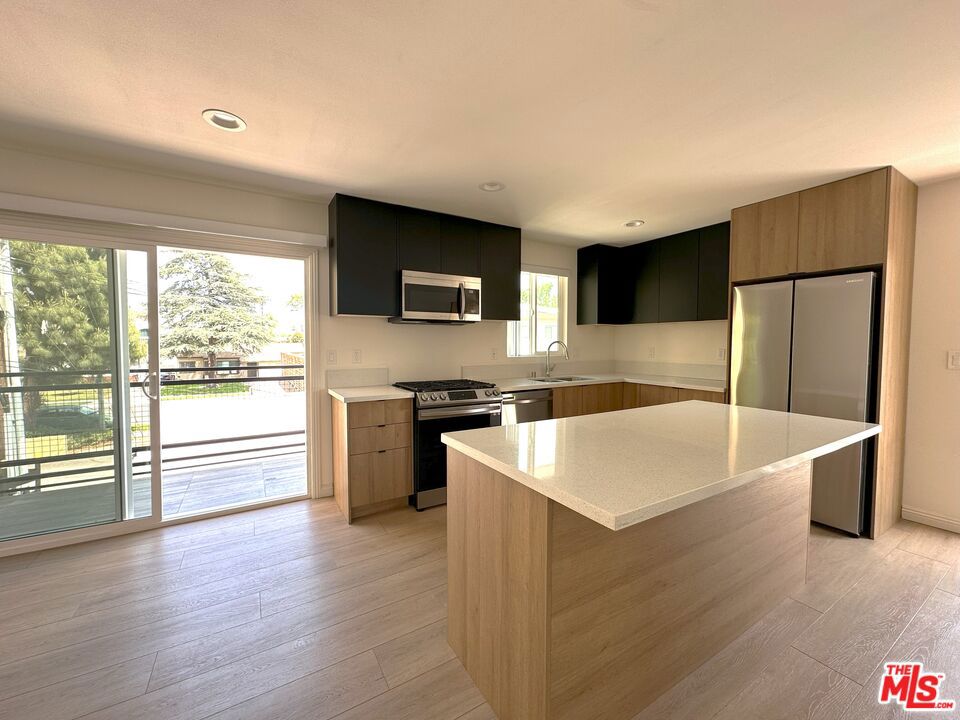 Light-filled and thoughtfully designed, this unit was made for comfort and ease - with no shared walls, windows on every side and elevated privacy throughout. Built in 2023 and updated with all the right touches, this 2 bed 2 bath layout offers clean lines, modern finishes and a natural sense of flow. Enjoy a spacious patio for slow mornings or relaxed evenings, modern appliances for everyday convenience and the ease of in-unit laundry. With one dedicated parking space and a bright, open feel, the home is as functional as it is inviting. Set in a charming pocket of Burbank close to parks, shops and dining - this one's easy to love. *Please note: Interior photos are of an identical unit with same layout and finishes. Exterior photos are of the unit itself.