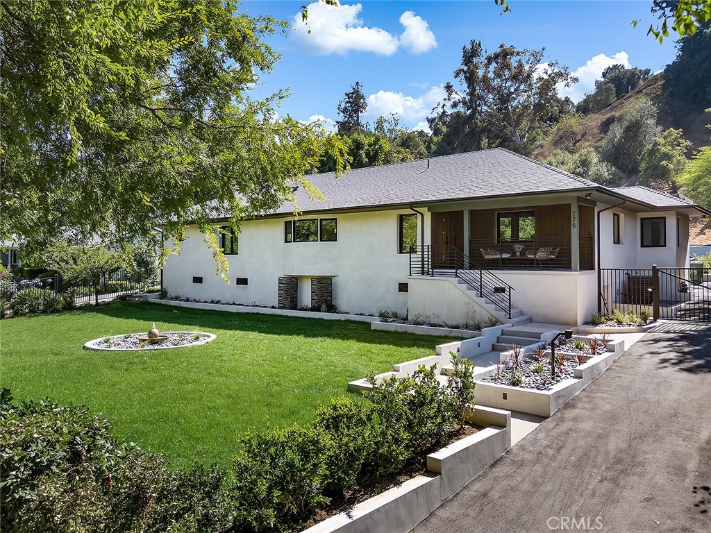 Situated in the coveted Linda Vista enclave, this fully reimagined home blends modern Zen-inspired design with luxurious functionality, all set on an expansive lot with a sweeping front lawn. A charming front porch welcomes you into a breathtaking open-concept layout. The chef’s kitchen is a true showpiece—featuring custom cabinetry, top-of-the-line appliances including a built-in refrigerator, a massive center island, and a striking wine storage wall. The kitchen flows seamlessly into the spacious great room, which opens to a serene backyard view—perfect for indoor-outdoor living.
The north wing of the home offers an inviting dining room accented by a rich feature wall, along with two secondary bedrooms that share a beautifully appointed, brand-new bathroom with designer tilework and upscale finishes. On the south wing, both the main and junior primary suites exude the elegance of a luxury retreat, each with a spa-like en-suite bathroom and generous walk-in closets. Step outside to a newly landscaped backyard oasis—complete with a tranquil fountain and a cozy firepit—ideal for quiet reflection or entertaining guests. The finished, insulated basement provides flexible space for storage, a gym, or creative studio. Some of the additional upgrades include:
• Brand new roof
• New dual-pane windows and doors
• New central air conditioning and heating system
• New water heater
• New Recessed lighting and designer lightings
• New Wide-plank wood flooring and accent paneling
• New Spacious 3-car garage door with gated access
This rare offering delivers the perfect harmony of comfort, style, and modern convenience in one of the area's most desirable Rose Bowl neighborhoods.
