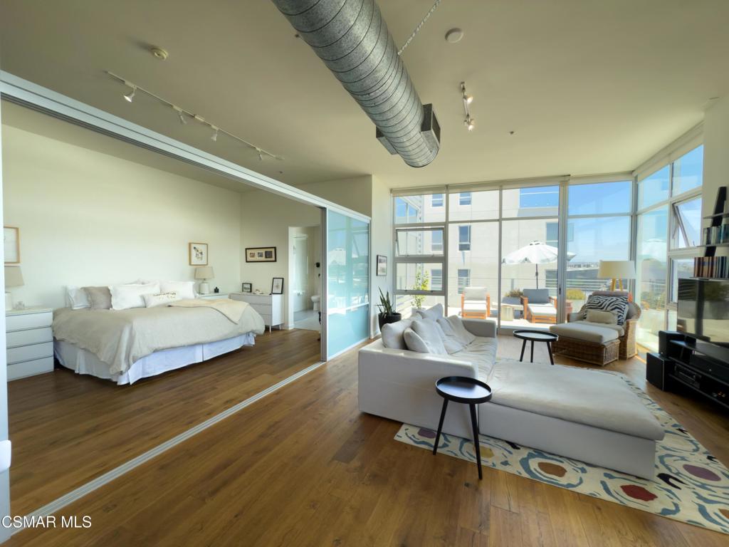 Top-floor corner unit in Marina del Rey's coveted Gallery Lofts--just minutes from the beach. One of the largest balconies in the building invites you to enjoy morning sun and ocean air in style. Inside, floor-to-ceiling windows flood the open-concept space with light. The kitchen is outfitted with sleek custom cabinetry and plenty of storage.This urban-style loft includes a spacious bedroom with an oversized closet. In-unit washer/dryer, Nest-controlled central air and heat, and a mobile island make daily living feel effortless.The gated garage includes two tandem parking spots directly in front of your private elevator, plus a large storage locker and ample guest parking. Community amenities include two Viking grills, a fire pit, bike storage, lounge areas, picnic tables, daily cleaning of shared spaces, common-area Wi-Fi, and AI-secured entry gates.Modern design meets beachside ease at 4080 Glencoe.