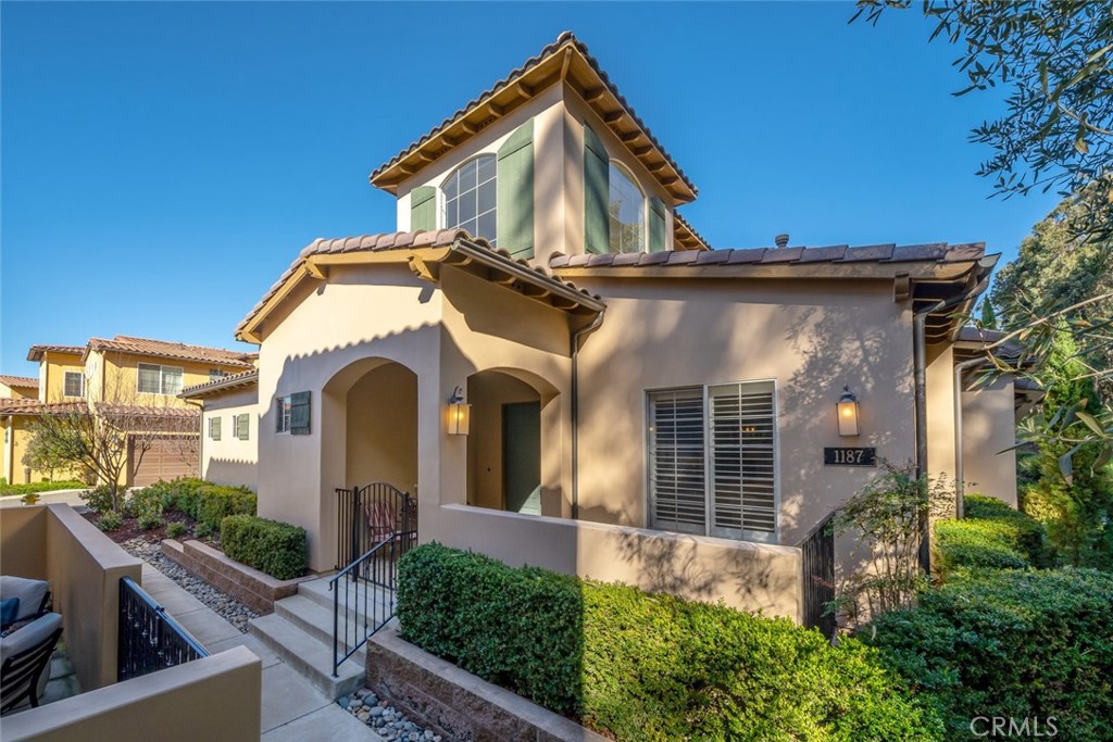 Townhome living at it’s best! This stunning Mediterranean style townhome is everything you need and more to live life to the fullest. Located in Trilogy Monarch Dunes, just around the corner from the clubhouse and all the superb amenities, this townhome really delivers - a gorgeous, HIGHLY SOUGHT-AFTER END UNIT located next to the Monarch Butterfly Preserve, 3 spacious master suites all with full bathrooms and walk-in closets (one on the ground floor), and top-notch, on-trend designer upgrades throughout. Enter through a gated patio - there’s plenty of room for a barbecue, seating, and garden pots - this will easily be your go-to spot to relax with a glass of locally-sourced wine and take in the serene wooded surroundings. Inside, you’re met with open-concept living with exquisite hand-scraped engineered wood flooring and plantation shutters. A welcoming living room awaits with a cozy fireplace to gather, surrounded by well-appointed built-ins. The dining room is right off the kitchen, perfect for hosting friends and family, and a sweeping bar-height granite island overlooks the kitchen for casual everyday dining. The well-thought-out culinary kitchen features sleek stainless appliances, rich walnut-tone Shaker-style cabinetry, granite countertops with subway tile backsplash and a roomy walk-in pantry. Adjacent is a convenient powder room with pedestal sink and a full-size laundry. The ground floor owner’s suite offers a spacious bedroom that’s light and airy with a walk-in closet. The luxurious en-suite bathroom offers a granite counter, plenty of storage, and a shower/tub combo. Upstairs you’ll discover the other two master bedroom suites, each with a full luxury bathroom and a walk-in closet. The larger one sports a beautifully tiled shower, dual sinks, granite countertop and a fully-outfitted walk-in closet. The remaining suite is identical to the ground floor one. In addition, there’s a floor-to-ceiling linen closet upstairs, a 2-car garage, surround sound, security system, plus all the fabulous amenities Trilogy has to offer - pool, gym, clubhouse, art studio, tennis/pickle ball courts, Adelina’s Bistro, and so much more. This spectacular, turnkey townhome offers you the carefree lifestyle you’re looking for, and when you wish to travel, just lock the front door and you’re ready for whatever adventure awaits.