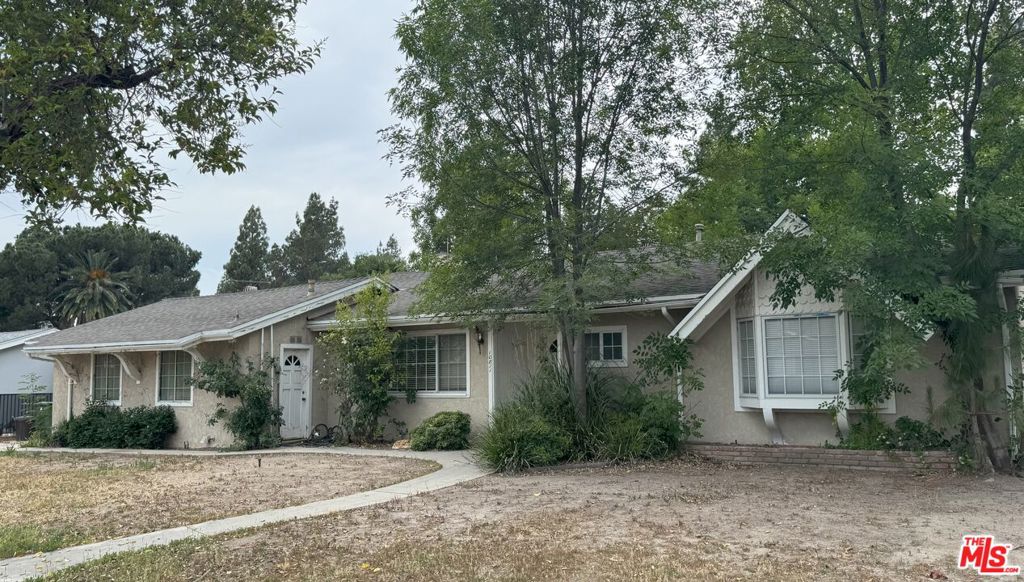 Beautiful home in the heart of Porter Ranch. This mid-century home features 3 bedrooms and 2 baths, a large family room with a fireplace, hardwood floors throughout, large kitchen with an open dining area. There is also an attached guest suite with it's own private entrance and exit to the backyard, perfect for entertaining and accommodating visitors. Home is equipped with solar roof panels. This property comes with a large 2 car detached garage and sits on an 11,343 square foot lot. Plenty of back yard space with the potential to build a detached ADU. Home is being sold as-is and with all faults know or unknown. This information has been secured from sources we believe to be reliable, but we make no representations or warranties, expressed or implied as to the accuracy of the information. References to square footage and/or age are approximate. Buyer must verify the information contained herein and bears all risk for any inaccuracies. THE INFORMATION CONTAINED IN THIS LISTING IS NOT TO BE RELIED UPON. BUYER(S) MUST DO THEIR OWN DUE DILIGENCE.
