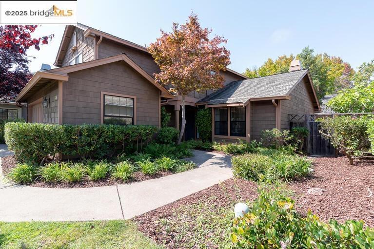 Welcome to 311 Channing Way, a beautifully updated Clipper Cove residence that blends comfort, elegance, and an ideal Alameda location. This 3-bedroom, 2.5-bath home opens with a dramatic living room featuring a floor-to-ceiling fireplace, vaulted ceilings, crown molding, custom shutters, and light laminate flooring. The formal dining room flows seamlessly to the private, landscaped backyard through wooden trimmed doors—perfect for entertaining or quiet evenings outdoors. The updated kitchen boasts granite countertops, a stainless steel refrigerator, an eat-in dining area, and generous storage. Upstairs, the serene primary suite showcases vaulted ceilings, custom shutters, a walk-in closet with mirrored doors, and a spa-like bath with granite dual vanities, a soaking tub with a spacious shower. Two freshly painted secondary bedrooms and an updated guest bath complete the upper level. Additional highlights include a two-car garage with a bonus room ideal for a home office, an HOA-maintained front yard, and a lush backyard retreat. Just moments from the ferry, shoreline trails, the lagoon, and bay views, this home offers both everyday convenience and the charm of Alameda’s coastal lifestyle.