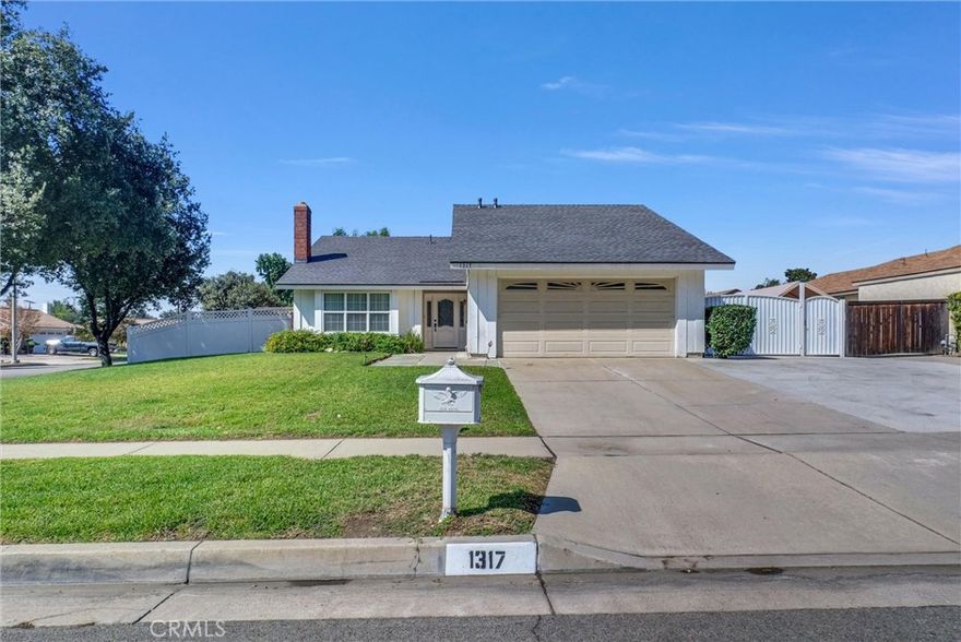 You'll love this beautiful 3 bedroom 2 full bath single story home.  As you walk through the lovely double entry doors, you'll come into the cozy living room with cathedral ceilings, warm fireplace and plenty of light throughout. The kitchen has been updated with new quartz counter top and has direct garage access.  This lovely house has new vinyl floor throughout, new bathroom counter tops and new paint throughout.  Laundry area is conveniently located inside the two car garage.  Enjoy a bbq or family gatherings in the large backyard.  All major appliances and gardener service included.  Have and RV? No problem!  This property has RV parking and an extra large drive for 4 additional vehicles.  Conveniently located near shopping, freeway and the University of Redland.