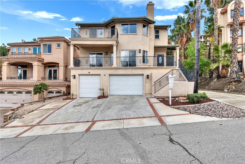 Motivated seller! Location, location, location! Elegant Canyon Lake home featuring 4 bedrooms and 4.5 bathrooms, including a separate income-producing apartment. Recently remodeled with a brand-new kitchen, updated bathrooms, and fresh flooring! The spacious family room flows into a kitchen with a breakfast nook, and there’s a convenient full bathroom on the main level. Upstairs, you’ll find a large primary suite with a cozy fireplace, walk-in closet, and a stunning bathroom with double sinks, a big shower, and a relaxing bathtub. Step out onto your balcony and enjoy some lake views with your morning coffee! Two additional bedrooms and a full bathroom are also located upstairs. The 3-car garage includes a large bonus room that can be used as an office.
The income-producing downstairs unit (please do not disturb tenant) has its own private entry and features a charming kitchenette, living room, bedroom, and one and a half bathrooms. For added convenience, the garage includes washer and dryer hookups.