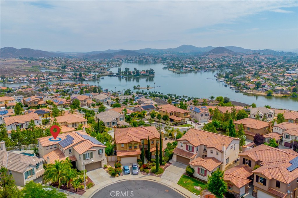Stunning Lake View Pulte Home with Luxurious Features and Resort-Style Backyard. Welcome to 29 Plaza Lucerna, this beautifully appointed 4-bedroom, 3.5-bathroom home offering 3,404 square feet of elegant living space with breathtaking lake views and luxurious upgrades throughout and FULLY FURNISHED. Step inside to discover tiled flooring, crown molding, and a striking two-tone stair banister that sets the tone walking through the open concept. The home features both a formal living room and formal dining room, perfect for entertaining, along with two cozy fireplaces that add warmth and charm. The gourmet kitchen is a chef’s dream, equipped with stainless steel appliances, a cooktop with hood, granite-tiled countertops, and a convenient butler’s pantry. The family room opens seamlessly to the kitchen, creating a welcoming space for gatherings. Retreat to the expansive master suite, complete with a private sitting area, deck with panoramic lake views, and a spa-like master bathroom featuring a sunken tub, tiled walk-in shower, and elegant vanity. The home also includes Jack and Jill bedrooms, ideal for all families. Additional highlights include AC units, Water Heater and exterior paint within the last two years, ceiling fans in every room, plantation shutters, and abundant natural light throughout. Step outside to your resort-style backyard oasis featuring a sparkling pool, relaxing spa, built-in fire pit, and outdoor BBQ—perfect for enjoying Southern California living year-round. This exquisite home offers the perfect blend of comfort, luxury, and scenic beauty. Low tax rate of only 1.3%. Don’t miss the opportunity to make it yours! Virtual Walk through Coming Soon!