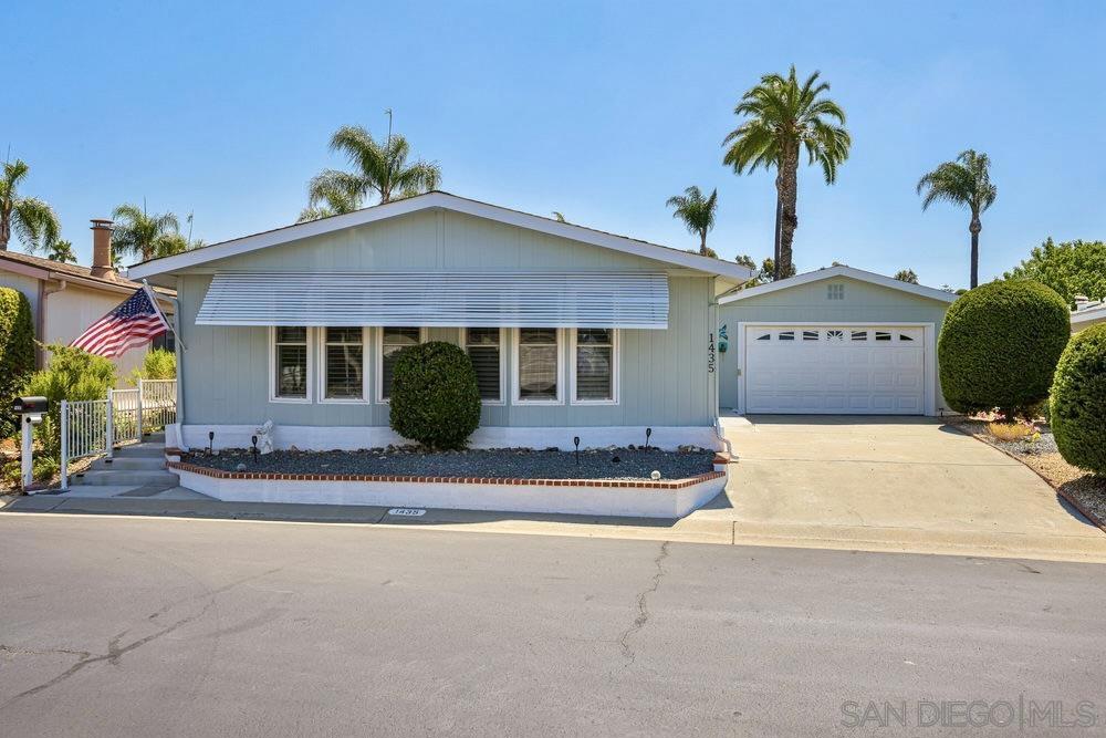 Experience relaxed coastal living in this beautiful 2 bed, 2 bath home with 1,680 sq ft of space in one of Oceanside’s most desirable 55+ gated communities — Pilgrim Creek Estates, where you OWN the land! This spacious single-level home offers a light-filled living room, a separate family room, and a large primary suite with an updated bathroom featuring double sinks. The spacious kitchen includes a modern Samsung Induction Cooktop, generous cabinetry, and storage galore. Enjoy year-round indoor-outdoor living with an expansive covered patio perfect for entertaining or unwinding. The two-car garage comes with built-in storage cabinets and a cedar-lined closet for added luxury. Wood laminate flooring throughout adds warmth and style. The community features beautifully landscaped grounds and top-notch amenities including a clubhouse, billiards, gym, heated pool, hot tub, and free RV parking. Don’t miss this rare opportunity to live in comfort, style, and community. Come see what makes Pilgrim Creek Estates so special!