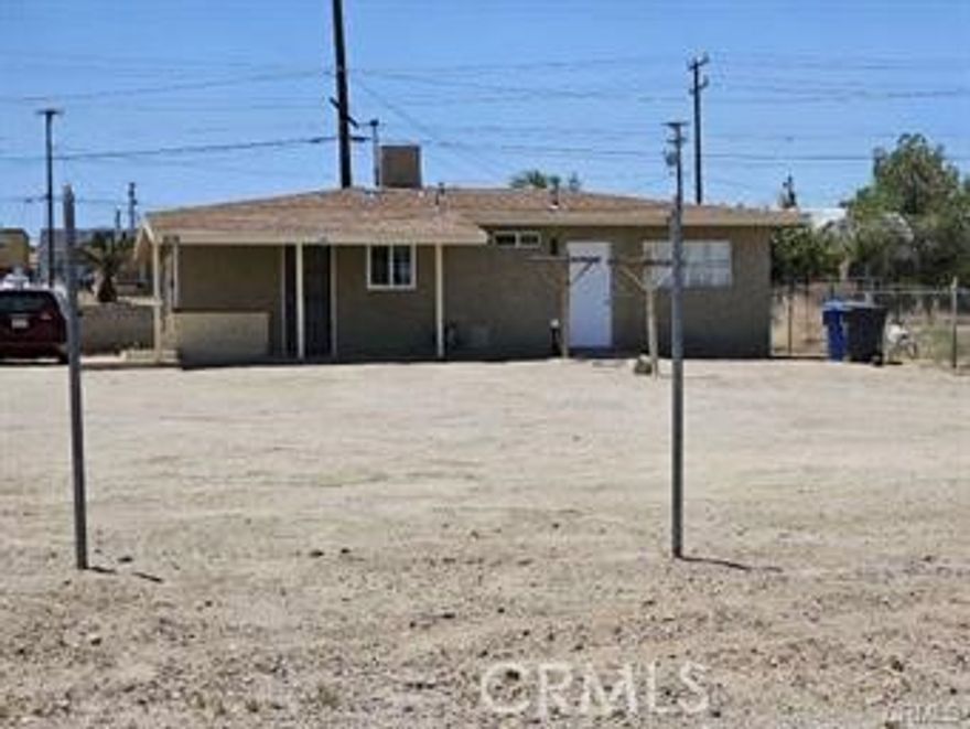 This is the perfect starter home!  This 950 sq ft home is completely move in ready with new paint, floors, windows, bathroom and kitchen remodel.  The lot is large enough for lots of extra parking or even to build an additional unit.  It would even be a perfect rental property to start your portfolio.  Take a look!