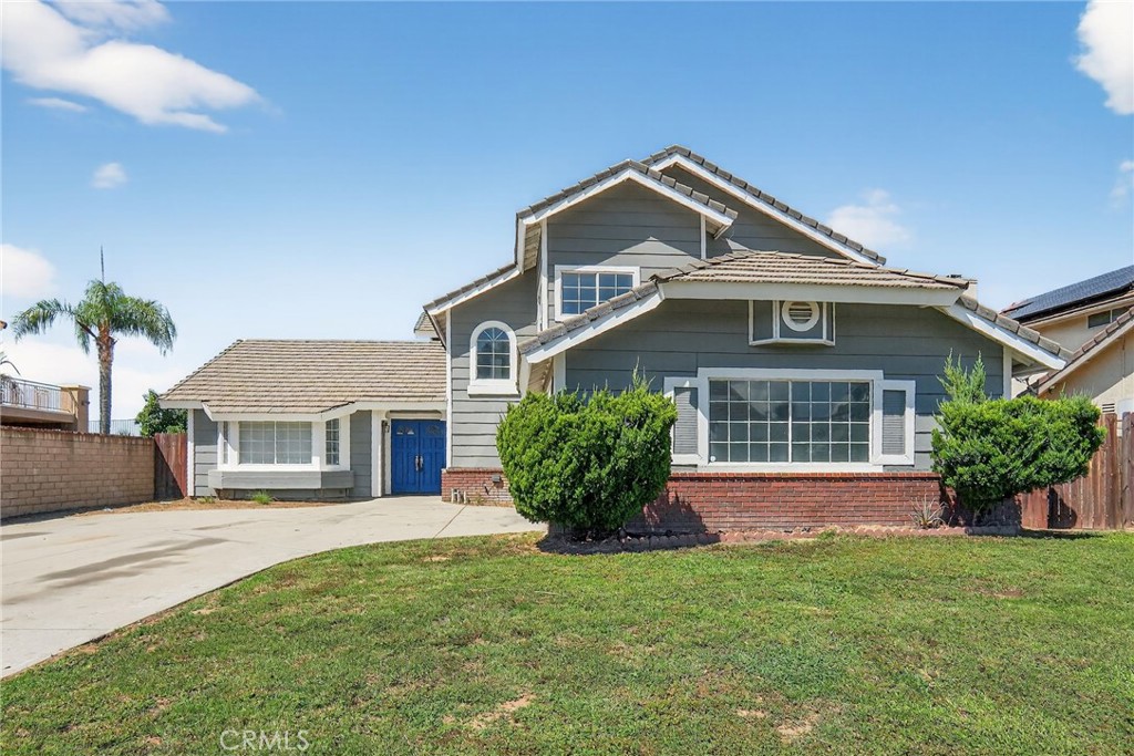 Updated within the last year, this gorgeous two story home located in the north part of Moreno Valley is an absolute gem! Built on a lot size of 8,276 sqft, this 4 bedroom 3 bath home features laminate flooring throughout downstairs formal living and dining rooms, kitchen, family room and downstairs bedroom. Kitchen boasts beautiful granite countertops, stainless steel appliances and sink, and is open to the family room with fireplace. Property has a downstairs laundry closet, a spacious 2 car garage and a large backyard with views to Moreno Valley with lots of potential. Don't wait to see this lovely home!