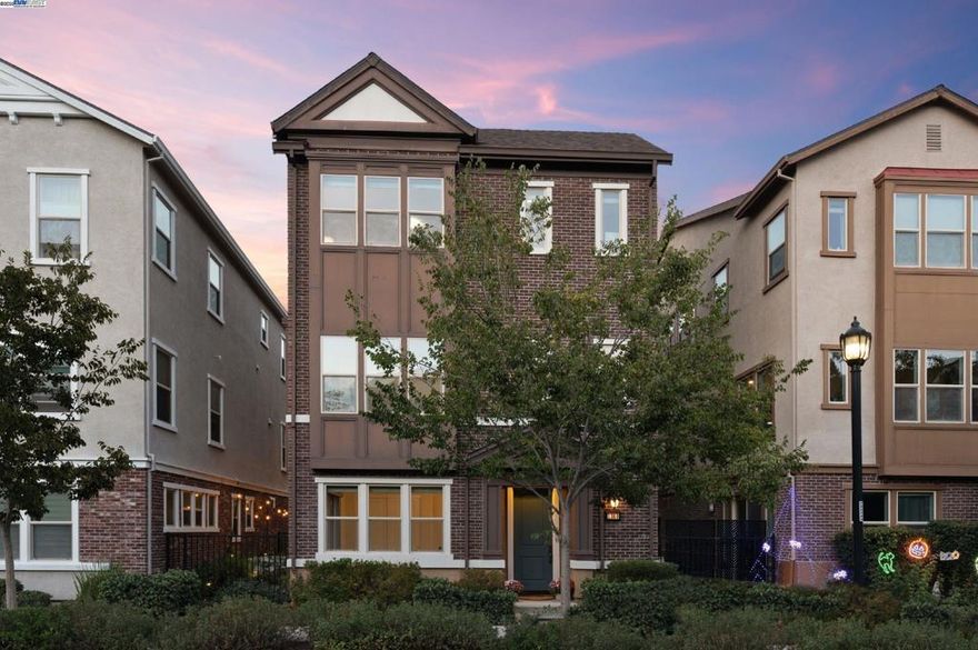 Rare opportunity - Township Square development with an elevator! Resort style amenities-clubhouse with pool, spa, fitness center, playground, BBQ, bocce ball court and more! Modeled after the Brownstones in New York, this "like-new" home is a three-story, 4 bedroom, 3 1/2 bath 2856 square foot masterpiece that is easily accessible with a private elevator, ideal for multi-generational living. The home features new carpet, hardwood floors, and 49 windows spanning over three floors making it light and bright. Incredible living options with a large bedroom/office and full bath on the first floor with access to a side yard and easy access to an oversized 2-car garage which is pre-wired for electric car charger and provides maximum  second floor hosts a chef's kitchen complete with extra storage, white quartz countertops, Bosch SS appliances, gas cooktop, oversized island, spacious deck perfect for alfresco dinning. Third floor features the primary suite with a large walk-in closet, updated bathroom, 2 large secondary bedrooms, updated hall bathroom, and an oversized laundry room. Close to top-rated schools, Bernal sports park, fairgrounds, dining/shopping, and downtown. Enjoy views of the Pleasanton ridge & designated open space. Convenient access to I-680, I-580, ACE, and BART. Views:  Ridge