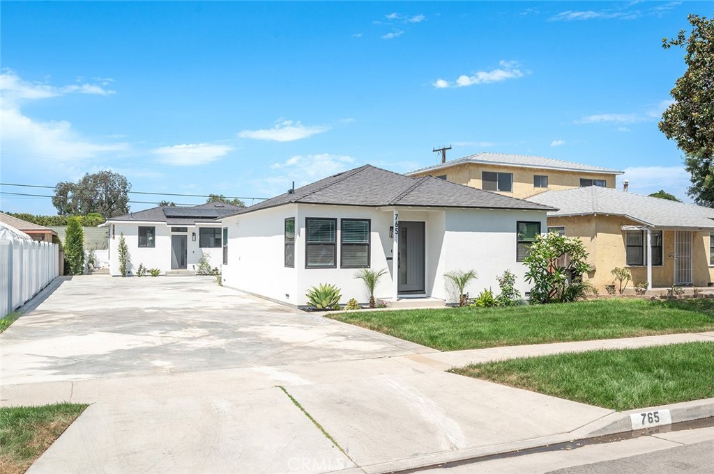 Amazing opportunity to own this beautifully renovated property offering the perfect blend of comfort, functionality, and investment potential. Ideal for extended families to live close together while maintaining privacy. The main house has been fully updated with new electrical, plumbing, HVAC, windows, flooring, kitchen, and bathroom—giving you peace of mind for years to come. In the back, you’ll find a newly built ADU featuring 3 spacious bedrooms and 2 bathrooms, ideal for extended family, guests, or generating rental income. With ample parking for both units, this home is designed for convenience and flexibility. Whether you’re looking for a multi-generational living solution or a smart investment opportunity where you can live in one home and rent the other, this property checks all the boxes. Don’t miss this unique opportunity to own a fully upgraded property with built-in versatility which is the perfect turn-key investment opportunity available in today's market!