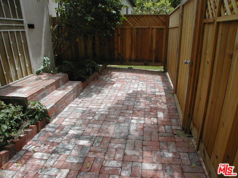 ENCHANTED COTTAGE! Custom remodeled 1 bedroom 1 BATH CHALET, kitchen with new STAINLESS STOVE, REFRIGERATOR, WASHER/DRYER! PRIVATE OUTDOOR FENCED W/ USED BRICK PATIO for entertaining and easy relaxation!! Newly remodeled , this custom unit has newly refinished natural hardwood floors,NEW FLOORING IN KITCHEN, NEW WASHER/DRYER IN UNIT!! Serene oasis, A CORNER UNIT with no neighbors above. One car parking. Walking distance to the best shops, cafes, boutiques on one of Santa Monica's most prestigious "University" streets! Close to Brentwood, bicycle to beach, easy 10/405 freeway access. An alternative to multi-unit apartment living. This feels like a pristine, private home. For the creative, discriminating individual. Pet are OK. Water not included.. AVAILABLE September 1,2025!