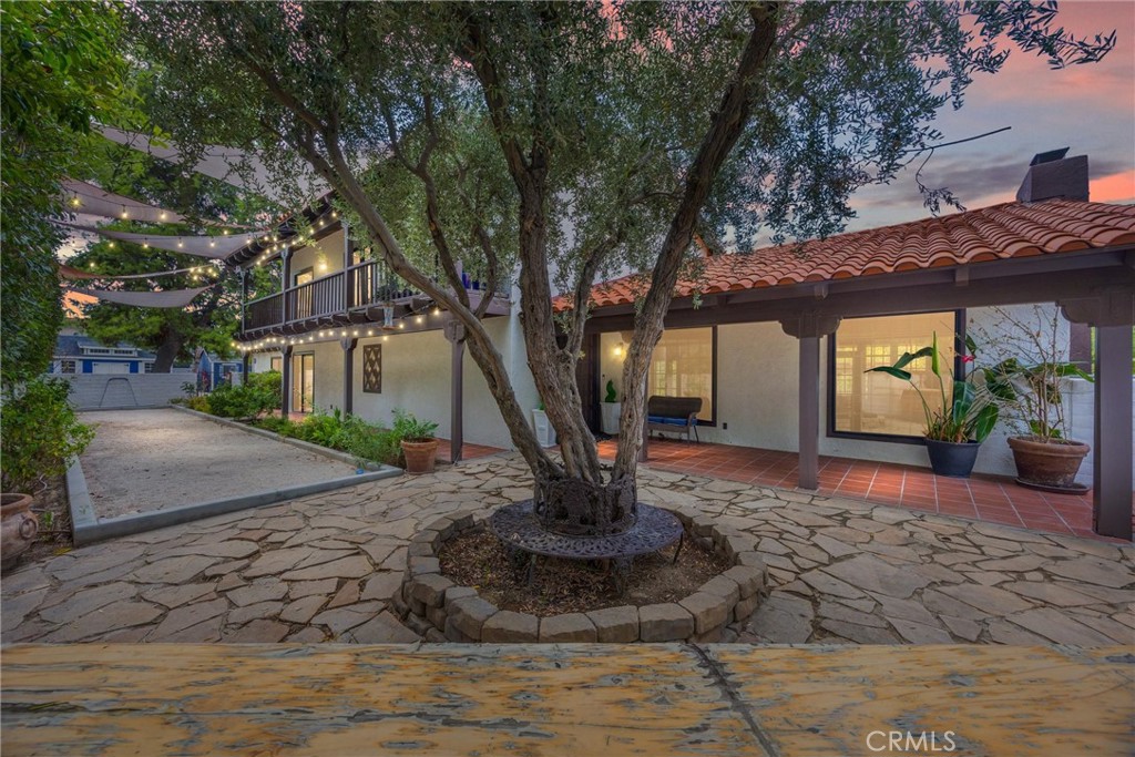 Welcome Home.... to this unique and one of kind villa tucked in Country Club Estates just a short walk to Bakersfield Country Club. The property is a true oasis and features everything your family needs to have your own private resort. The interior boasts high ceilings and open concept complete with fire place and wall to wall tile and large windows . The kitchen is a chefs dream, complete with 3 large wine refrigerator, commercial stove and extra large refrigerator with lots of counter space. The living quarters are spacious with plenty of room for the whole family which include 4 bedrooms and a flex room that gives your family the option for a 4th bedroom. Let's also include4 well designed bathrooms that round out the living quarters.
The backyard is a true paradise for the outdoor entertainers, with mature trees, complete with pool, waterfall, covered patio, built-in BBQ and much more. Did we mention the pickle ball / basketball court with RV parking and much more. Visit TODAY.