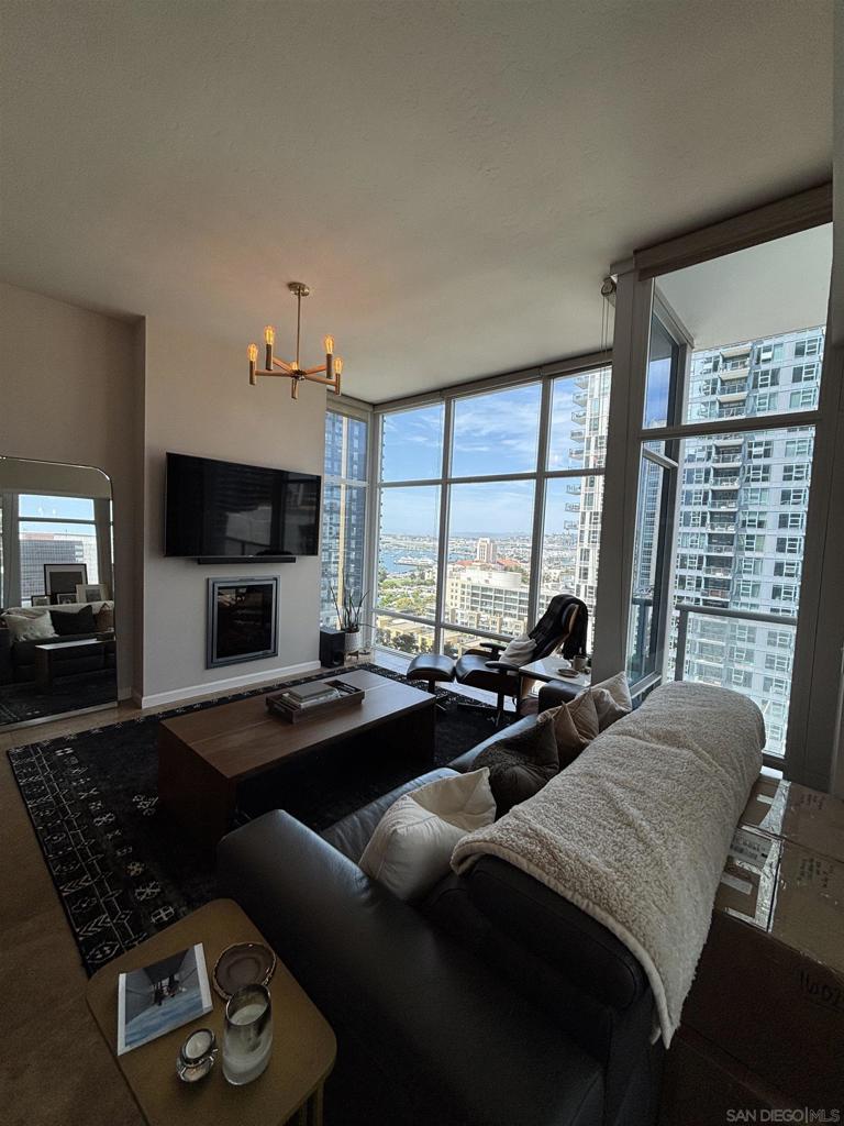 Welcome to urban living at its finest in the heart of San Diego! This exquisite luxury highrise condo at 1262 Kettner Blvd in one of San Diegos premiere buildings; Sapphire tower. This condo offers a perfect blend of style, comfort, and convenience. Spanning 1,283 square feet, this residence is designed to impress with its modern layout and premium finishes. 2 Parking Spaces in underground parking structure!! Step inside to discover a spacious living area featuring plush carpet and sleek tile floors that lead you through this beautifully appointed home. The open-concept kitchen is a dream, complete with an island, breakfast nook, and included Sub Zero refrigerator. This condo boasts two generously sized bedrooms, each thoughtfully designed for comfort and relaxation. The primary ensuite bathroom is a true retreat, featuring a double sink, separate tub, and walk-in shower. An additional well-appointed bathroom ensures convenience for residents and guests alike. Ample storage is available with walk-in and dual closets, making organization a breeze. Enjoy the comfort of central air conditioning and forced air heating to maintain the ideal climate year-round. The in-unit washer and dryer add an extra layer of convenience to daily living. Residents have access to a Rooftop Pool, common media and recreation room, perfect for social gatherings or unwinding after a long day. Embrace the vibrant energy of downtown San Diego while enjoying the modern comforts of this stunning condo. Don't miss the opportunity to make this urban oasis your new home!