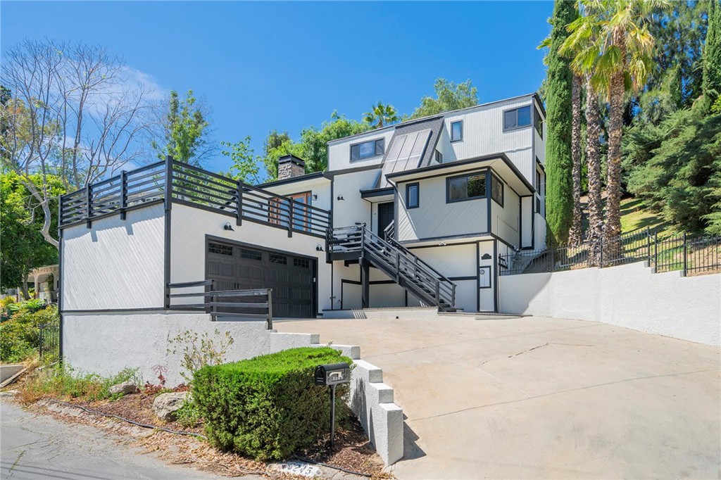 This five-bedroom/three-bathroom property is situated on a pristine neighborhood street, just south of Ventura Boulevard. This home is on a quiet neighborhood street with a fenced backyard and a 2 car garage. The view from a large outdoor patio provides daily sunsets and wide open panoramic views. The main living room has arched ceilings with exposed beaming, bar area and a gas fireplace. The kitchen has stainless steel appliances (ex. Double Oven/Stove, Dishwasher, Microwave, Refrigerator) and Garbage Disposal. The home has hardwood and Terracotta flooring, recessed lighting, central heat/air-conditioning, and washer/dryer hookups. Nearby Ventura Boulevard has a multitude of retail and commercial services and entrance to the Ventura (101) Freeway. Also close by is the Woodland Hills Country Club, and the Serrania Park.