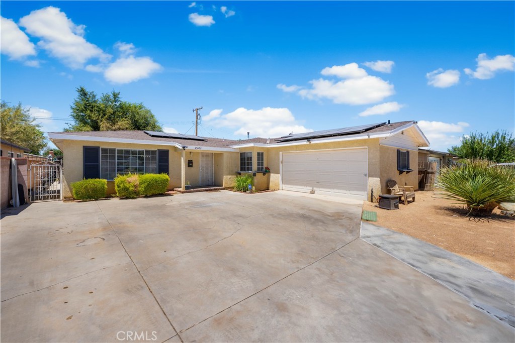 This inviting 3-bedroom, 2-bath home is located in a desirable West Lancaster neighborhood. The updated kitchen features quartz countertops, and the spacious bedrooms offer plenty of comfort. Enjoy a large family room with a big loft and a beautiful fireplace, perfect for relaxing or entertaining. Additional highlights include laminate flooring, a newer roof, a newer AC unit, and solar panels. Outside, discover a big backyard with endless possibilities—garden, play, or design your dream outdoor retreat. There's also a covered patio and a bonus room ideal for a studio or office. The garage has been converted into an unpermitted ADU. This home is move-in ready—schedule your viewing today!