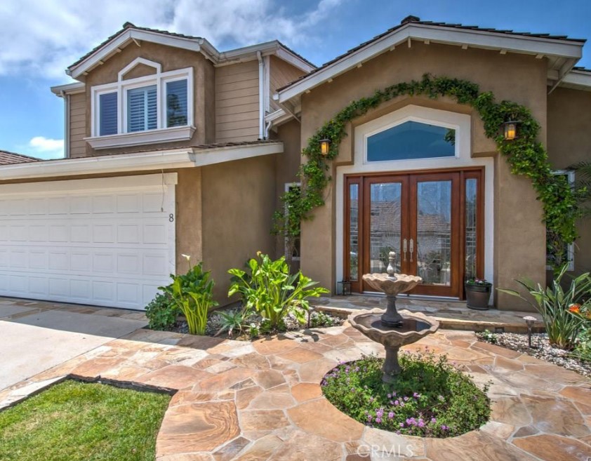Welcome to this stunningly remodeled and thoughtfully expanded home in the highly sought-after Gables community of North Lake. Just a short stroll to the lake, Eastshore Elementary’s Appis program, and the Tennis Club, this location is unbeatable.
With nearly 3000 sq. ft. of living space, this elegant home boasts strong curb appeal with custom double leaded-glass entry doors and a charming Italian-style fountain. Inside, the open layout features travertine floors and multiple living and dining spaces and is perfect for entertaining and everyday living.
The bright, all-white kitchen is a chef’s dream with a spacious marble island, 5-burner gas cooktop, stainless steel refrigerator, double ovens, and wide garden-facing windows that flood the space with natural light.
Additional features include: New water heater, Updated roof and HVAC system, Whole-house tented extermination, Direct garage access, Main-level office, laundry room, and two cozy fireplaces.
Upstairs, you’ll find four beautifully appointed bedrooms, each with plantation shutters, ceiling fans, and custom California Closets. The spacious primary suite includes a built-in window seat, a luxurious bathroom with Italian stone finishes, dual sinks, a soaking tub, and a customized walk-in closet.
Tastefully painted in soft café au lait tones with crisp white trim, this home also offers a low-maintenance wraparound patio with fountains, a built-in BBQ, and mature fruit trees including pomegranate, lemon, and lime.
Don’t miss this rare opportunity to live in one of Irvine’s most desirable neighborhoods near the water.