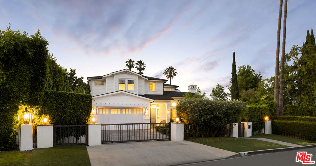 Nestled south of the boulevard in Sherman Oaks, this Cape Cod-style home is a masterpiece curated by renowned celebrity designer Jeff Lewis. Boasting five bedrooms, each with its own ensuite bathroom, the residence offers ample space for comfort and privacy. It includes an office for work, a custom theatre room for entertainment enthusiasts, and a detached gym that doubles as a guest unit, complete with bathroom facilities and included equipment. A standout feature is the one-of-a-kind three-part tree house connected by bridges, adding a whimsical charm to the property.Technological sophistication is evident throughout the home with a Control 4 system for seamless automation, ensuring convenience in managing various aspects of daily living. The kitchen is a chef's delight with high-end finishes, complementing the spacious layout designed for hosting gatherings. Outside, an expansive entertainer's backyard beckons with a swimming pool and spa, perfect for hosting large parties or relaxing in private. All tech devices and TVs are part of the package, enhancing the integrated living experience.Situated on a generous lot exceeding 13,000 square feet, the residence offers proximity to shopping, dining, and easy access to the Westside, making it a coveted location in Sherman Oaks. This home represents a harmonious blend of luxury, functionality, and entertainment, promising a lifestyle of comfort and sophistication.