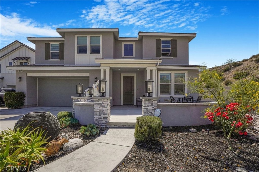 Welcome to Your Dream Home in Santa Clarita’s Exclusive Skyline Community!
Situated on one of the largest lots in the neighborhood, at the top of the hill and at the end of a quiet cul-de-sac; this stunning 5-bedroom, 3-bathroom contemporary home offers a rare blend of luxury, comfort, and functionality in one of Santa Clarita’s most desirable communities.
Step inside to discover soaring ceilings and expansive windows that fill the space with natural light and showcase breathtaking canyon and mountain views. The open concept floor plan creates a seamless flow between the chef-inspired kitchen, spacious living areas, and custom-designed electric fireplace, perfect for both relaxed family living and stylish entertaining.
A full bedroom and bathroom on the main level provide ideal flexibility for guests, multi-generational living, or a home office. There’s also a bonus room currently used as a gym that could easily be converted into a sixth bedroom, office, or playroom. Upstairs, you’ll find four more generously sized bedrooms, all with custom closets, along with two full bathrooms. The primary suite is a true retreat, featuring panoramic views, a spa-like ensuite with a double vanity, and generous storage throughout. Don’t miss the indoor open-air media room, perfect for movie nights, game days, or quiet relaxation.
The real showstopper is the backyard, designed to entertain and impress! It features a 4-hole putting green with creative obstacle landscaping, a fire pit, and an elevated platform perfect for live music or DJ sets, making it a favorite hangout for both kids and adults. There’s even enough space to add a full-size swimming pool if desired.
Additional highlights include a 2-car garage with driveway parking for three extra vehicles; drought-tolerant landscaping in the spacious front yard, a dedicated laundry room with hookups, owned solar panels, and million dollar views from nearly every angle.
The Skyline Community offers two private clubhouses with amenities including resort-style pools, kids’ water play areas, and beautifully maintained parks.
This home is more than just a place to live, it’s a lifestyle destination for families who love to host, relax, and enjoy the very best of Southern California living. Don’t miss your chance to own one of Skyline’s premier properties, served by excellent schools, it offers the perfect balance of comfort, beauty and quality education. Contact the listing agent today!