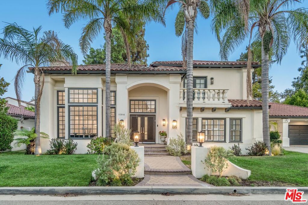 Tucked behind gates on a quiet street in the heart of Encino, this 4BD/4.5BA home is a private retreat that effortlessly blends classic style with modern comfort. A manicured lawn and inviting facade set the tone, while inside, high ceilings and an open, light-filled layout make an immediate impression. The main living spaces are both stylish and functional, offering plenty of room to relax or entertain. The chef's kitchen is a standout with top-of-the-line stainless steel appliances, custom cabinetry, and a large center island. A formal dining room sits just off the kitchen, perfect for hosting dinners or celebrations. Upstairs, the bedrooms are spacious and serene, including a generous primary suite with a separate sitting area, walk-in closet, and a spa-style bathroom built for unwinding. Outside, the backyard feels like your own private resort. A sparkling pool is surrounded by mature greenery, creating a peaceful setting for everyday living or weekend entertaining. Other features include Nest smart home tech, security cameras, and a 3-car garage with plenty of storage. Located within a coveted Encino neighborhood and the Hesby Oaks School district, this home offers effortless access to parks, premier shopping, dining, and major freeways.