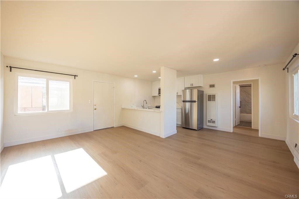 Experience modern comfort at 115 N Walnuthaven Drive Unit 5, a beautiful newly-renovated 1st level apartment in West Covina. This stylish residence features a spacious bedroom with ample closet space, a full bathroom with a bathtub, and a welcoming living room that seamlessly transitions into a well-appointed kitchen. Upgrades include brand new appliances, cabinets, countertops, vinyl flooring, and tile, ensuring both convenience and aesthetic appeal. Located just steps away from the 10 freeway, this apartment offers easy access to West Covina Plaza, Portos, local shops, gyms, entertainment venues, and more. Embrace the vibrant lifestyle and abundant amenities that West Covina has to offer from this centrally situated and meticulously updated living. Come see, appreciate, and make yourself at home!