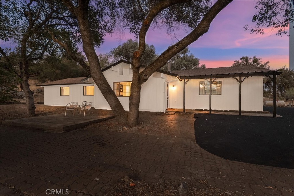 This amazing home has so much to offer for a great price! Located within walking distance to grocery, dining & more, you can enjoy meandering up the newly sealed driveway lined with cypress, sit on the front deck enjoying the sunset and feel the breeze. This kitchen has recently been remodeled to include new appliances & a farmhouse sink, new paint inside & out, newer vinyl flooring throughout & a new electric garage door has been ordered & will be installed. Lots of parking & space to play outside or build a lush garden. Beautiful rock outcroppings and mature eucalyptus trees. In the Yosemite Lakes Park community where there are so many amenities for your enjoyment, whether it's a home for vacation, retirement or little ones, there is something for everyone including a golf course, equestrian center, walking trails, club house, recreation center & swimming pool. Let's not forget Bass Lake & the gate to Yosemite National Park is not far!