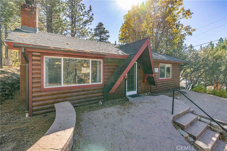 Live Auction! Bidding to start from $400,000! Charming Big Bear Lake cabin just steps from The Village! This updated 2-bedroom, 1-bath retreat offers vaulted wood-beam ceilings, a cozy river-rock fireplace, and tasteful upgrades throughout. Enjoy pine cabinetry, granite-tile counters, tile flooring, dual-pane windows, and a beautifully tiled bath. Both bedrooms feature sliding glass doors and elevated ceilings, creating a bright, airy feel. A spacious laundry/mud room adds convenience. Outside, relax on the stamped-concrete patio with peek-a-boo lake views or entertain on the back deck surrounded by mature pines. Large front and rear parking areas provide plenty of space for guests. Located less than 1/3 mile to The Village, the marina, and minutes to ski resorts, this cabin is ideal as a personal getaway or proven vacation rental.  This home embodies the best of Big Bear living — whether you’re seeking personal escape or rental return.