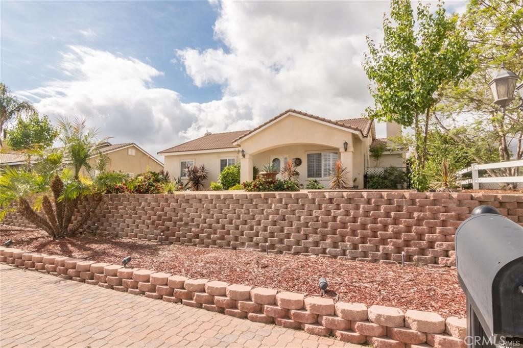Charming Single-Story Home on a Quiet Street with Mountain Views! This beautiful 3-bedroom, 2-bath home is nestled on one of the best streets in town, just a short walk from the local elementary school. Step inside to find brand new carpet throughout, and fresh interior paint in the bedrooms. The spacious master suite features a walk-in closet, and a second walk-in closet is found in one of the spare bedrooms-perfect for added storage or organization. Enjoy the warmth of a cozy fireplace, two pantries for ample kitchen storage. The homes comes complete with a washer, dryer, and refrigerator. Enjoy the peaceful setting with no front neighbors and take in the stunning mountain views. Equipped with solar panels and a back up battery system, this is the only house on the block that stays lit when power goes out-enjoy peace of mind and uninterrupted comfort. The expansive, pool sized backyard offers endless potential. Whether you're relaxing at home or entertaining guests, this home offers the perfect blend of comfort, privacy, and location.