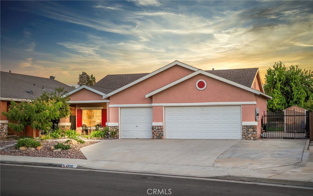 This beauty located on Hemet's east side neighborhood, "Valle Vista," checks all the boxes: single story, 4 bedroom, 3-car garage, RV parking, low taxes and...paid off solar! Featuring a lovely open concept floor plan with plank wood flooring, custom paint and window coverings along with a cozy fireplace in the living room, this home is ideal for entertaining and giving you plenty of room for all your furniture. The beautifully landscaped front yard makes this home the pride of the neighborhood and features loads of parking potential in the wide driveway with additional RV parking. The 4 bedrooms are spacious with room for large beds. The kitchen features custom quartz counters on the island and main cabinets with loads storage possibilities. The backyard offers a lovely patio cover with lots of privacy and has your citrus needs covered with several fruit trees including: navel orange, lime, blood orange and lemon. The solar panel system has been fully paid off so you'll get the added bonus to lots of free electricity to lower your cost of living. The Valle Vista area is a quiet area east of downtown Hemet and features spectacular mountain views and easy access to shopping and schools. Hurry, this rare opportunity won't last!