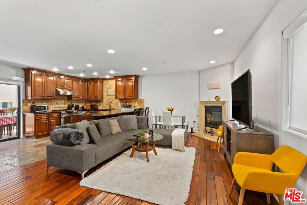 *Available: June 5* Welcome to your spacious and inviting oasis in the heart of West Hollywood. This exceptional single-level unit, ideally situated at the intersection of La Cienega and Santa Monica Blvd., offers the perfect blend of city living and homey comfort.This 3-bedroom, 2-bathroom front apartment stands out with its unique features. No common walls mean you'll enjoy unparalleled privacy and tranquility, making it truly feel like a home within the bustling city. But what truly sets this property apart is the access to an incredible rooftop with panoramic views that will leave you in awe. The open living area is designed to make you feel right at home, with ample space for relaxation and entertainment. The dining area is perfect for hosting gatherings and creating lasting memories, while the LARGE kitchen steals the show with its huge countertop and bar seating. Wood floors, French doors, and a balcony add to the charm and functionality of the space.The kitchen is a chef's dream, featuring a large center island with sleek granite counters. Top-of-the-line stainless steel appliances, including a stove, dishwasher, and refrigerator, make meal preparation a breeze. Additionally, a washer/dryer in the unit adds to the convenience of daily living.The bedrooms are carpeted for comfort, and the master suite offers a private retreat with its own en-suite bathroom. Two additional bedrooms provide ample room for family members or guests.A private patio enhances the outdoor experience, while access to a common area roof deck with more stunning views ensures that you'll never tire of the beauty that surrounds you. Two-car tandem parking in a gated garage ensures that your vehicles are secure and easily accessible.In summary, this West Hollywood condo offers a unique opportunity to experience the spaciousness and comfort of a home while enjoying the excitement of city living. Whether you're seeking a long-term residence or a retreat from the city's energy, this property offers the best of both worlds.