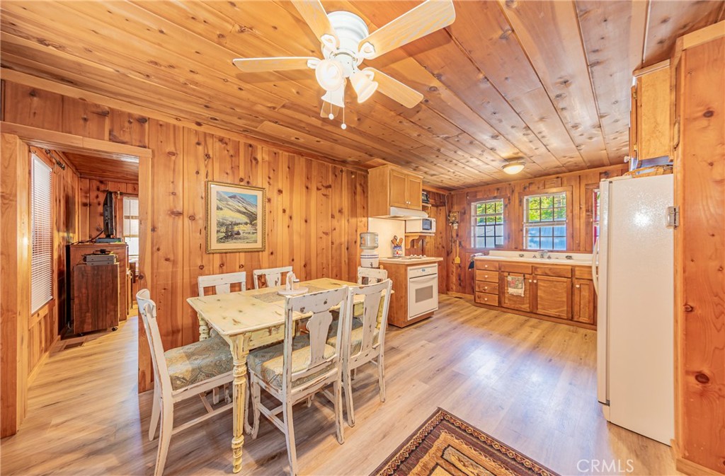 Imagine living amongst the tall pine trees at 4,000 ft in elevation with seasonal snow and approximately 15 minutes to Yosemite south entrance and approximately 15 minutes to Bass Lake. Drive away from the city to your second home in the mountains and potential income maker. The interior has knotty cedar walls and ceilings, one bedroom with a bed included and with a craftsman custom made murphy bed, one bathroom with a clawfoot tub/shower, toilet and a pedestal sink. The hall has a built-in cabinet, water heater and may have potential for a washer/ dryer stacker. A good size living room with two ceiling fans and craftsman custom made murphy bed. Plenty of windows throughout for natural lighting. Comes furnished and with appliances too!
Come check out this cozy rustic Sugar Pine cabin located in the Sugar Pine Community in the mountains. This is a community to come experience! Great history of a logging community that once roared in these mountains, the sounds of year-round Lewis Creek running through the community and a pond (privilege owner use) that was part of this community history. This cabin has had upgrades over time per sellers, which includes central heating and air conditioning 2019, laminate flooring throughout 2020, custom alder kitchen cabinets, a metal roof in 2019, Trex decking 2023, and a new water heater 2025. Make your appointment today.