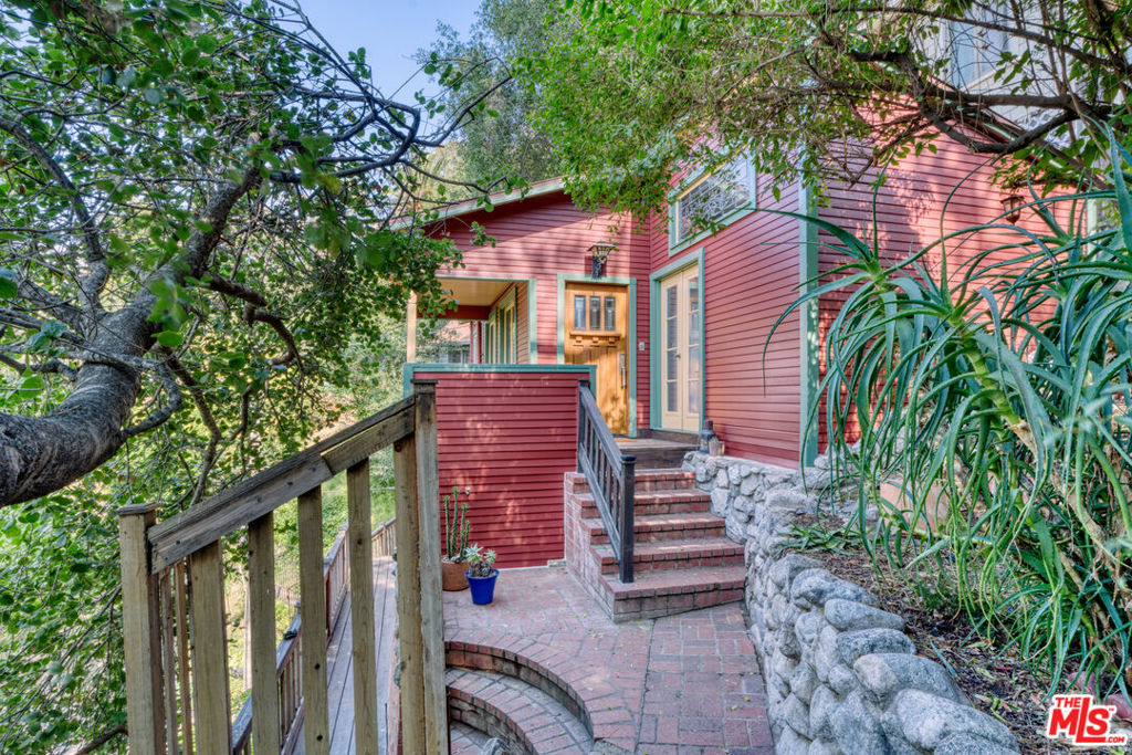 Tucked away in the hills of Elysian Heights, this charming 1923 cottage offers an abundance of character in a magical Echo Park setting. With warm hardwood floors, light-filled living spaces, serene views and vintage details including an O'Keefe and Merritt stove and clawfoot tub, this special home awaits a lucky new owner. Decades of careful attention have preserved this comfortable and well laid-out 1BR/1BA which sits in an enclave of special properties in the heart of LA's vibrant east side. Outdoor spaces offer gardens with a mix of cacti and native plants, as well as room to entertain while enjoying the views and surroundings of Echo Park and beyond in the side yards and front porch. Bonus space below the house functions as a laundry room and additional storage space. Located close to many of the area's best shops and restaurants such as Valerie, Cookbook and Canyon Coffee, plus Sunset Blvd, Elysian Park, the Silver Lake reservoir and its meadow. A rare and unique find to treasure for years to come.