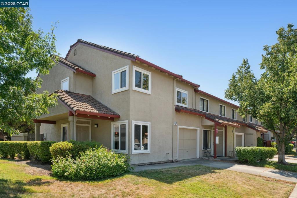 Bright Corner Townhome in Prime Concord Location! Welcome to this spacious and stylish 3-bdr, 2.5-bth corner unit in the desirable Cowell Terrace community. Step inside to a dramatic entry with tall ceilings and an elegant staircase that sets the tone for this light-filled home. The remodeled kitchen features granite countertops, stainless steel appliances, and an electric stove. Direct access to the private back patio is perfect for al fresco dining, entertaining, or unwinding in the open air. Updated bathrooms, recessed lighting, and fresh interior paint provide a move-in-ready feel. The primary suite boasts a ceiling fan, walk-in closet, and a spacious layout for added comfort. Throughout the home, enjoy durable laminate flooring, a Nest thermostat, and ample storage. Additional perks include an attached 1-car garage and convenient location with immediate proximity to shopping, dining, and transportation. Enjoy The perfect blend of comfort, space, and lifestyle.