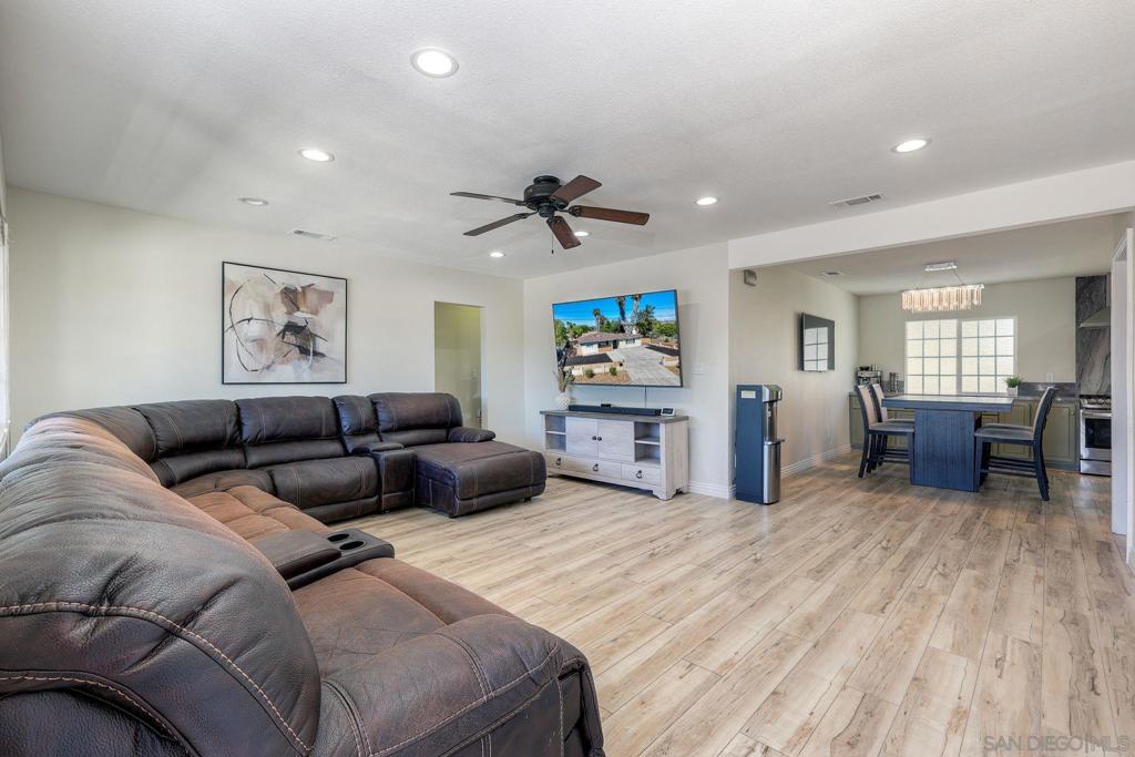 Remodeled 4 Bedroom/2.5 bath home on a quiet cul-de-sac with an expansive 11,400 sq. ft. lot. Offering ADU potential and a detached 2 car garage. Open floor plan with quartzite countertops, custom cabinetry, stainless steel appliances and vinyl wood flooring throughout. Enjoy newer AC, easy freeway access and walking distance to Pride Academy Elementary. A rare opportunity to own a larger lot close to shopping and eatries.