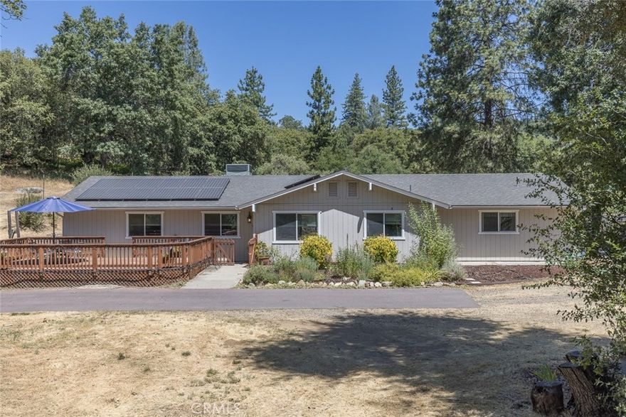 Escape to the peaceful Sierra foothills with this beautifully maintained 3-bedroom, 2-bathroom home nestled in Ahwahnee, CA. Just a short drive to world-renowned Yosemite National Park and only 30 minutes to the sparkling waters of Bass Lake. Enjoy the best of mountain living with the convenience of nearby shopping, dining, and services in Oakhurst, just minutes away. Situated on just over 2 acres of usable land, this property offers space, privacy, and self-sufficiency. The home features paid-off solar panels, the owner hasn't had an electric bills for years, and it's on a private well so no water bill either! Fiber optic internet is available, making remote work or streaming a breeze. Inside, you'll find a warm and inviting layout with ample natural light, spacious bedrooms, and a functional kitchen perfect for everyday living or entertaining. Outside is a fenced yard, there's plenty of room to garden, play, or just relax and enjoy the tranquil surroundings. This spacious lot also offers plenty of room for RV parking. Whether you're looking for a full-time residence, a vacation getaway, or an investment near Yosemite, this property checks all the boxes. Come see what makes this Ahwahnee gem so special!