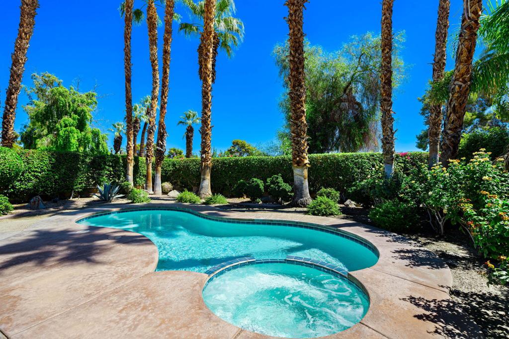 Rancho Mirage Country Club is a prestigious gated community where resort-style living perfectly blends with everyday comfort. This spacious 2,603 sq. ft. condo features 2 bedrooms, 3 bathrooms, and a versatile bonus room, all situated on fee land. Step inside to discover an open floor plan that offers generous living and dining areas filled with natural light. The formal living room is ideal for entertaining, complete with a bar and wine fridge. The family room provides ample space for hosting guests, whether seasonally or year round. A flexible bonus room is available, suitable for use as a home office, fitness area, or guest retreat.Enjoy your own private outdoor sanctuary featuring a sparkling pool and spa complete with newer equipment and updated pool tiles, creating the perfect environment for relaxation. The garage includes an insulated door and a mini split A/C system for added comfort.Residents of Rancho Mirage Country Club benefit from access to community pools and spas, tennis courts, and golf facilities with 10 holes currently open. The homeowners association (HOA) provides cable, internet, front yard landscaping maintenance, and 24/7 security, ensuring peace of mind.Ideally located in what feels like the center of the Coachella Valley, this home places you just moments away from Sunnylands, Eisenhower Medical Center, golf courses, shopping centers, and dining options.Enjoy the perfect balance of privacy, convenience, and the beauty of desert resort living at Rancho Mirage Country Club.