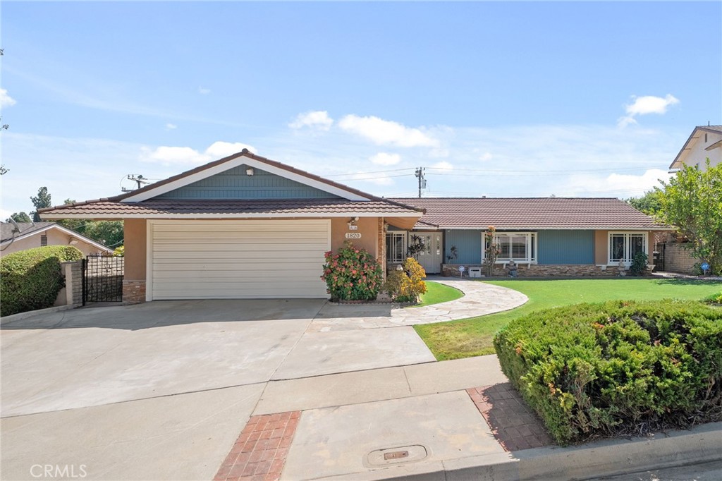 LOOKING FOR A STYLISH POOL HOME WITH AN OUTDOOR KITCHEN? This contemporary single-story home in Hacienda Heights is perfect for your active family! Enjoy an open floor plan with tile and laminate flooring, plantation shutters, beautiful sliding glass panel doors with sidelites, upgraded windows, and extensive use of mirrored walls that significantly enhance the flow of natural light throughout this home. If you like to entertain, you will love this open design perfect for large furniture items and memorable get-togethers. This sleek kitchen features a center island/breakfast bar, an additional breakfast bar, stainless steel appliances, extra-wide refrigerator and ample storage. The kitchen is open to the dining area and spacious living room with a rustic stone fireplace and long mantle, and a view overlooking the pool. Relax in the primary suite with ensuite bathroom, tons of closet space, granite vanity and tiled shower with glass enclosure. There are 2 additional generous-sized bedrooms and a main bathroom with a sunken Roman tub and long vanity. Use the spacious permitted sun room as your game room, play room, home gym - a great flex space for your family! Outside, enjoy inviting curb appeal, healthy front lawn, curved pathway to the entry, private in-ground pool, gazebo, and outdoor kitchen! This outdoor Butler’s style kitchen offers a 2-burner cooktop, hood vent, electric outlet and ample cabinet storage. Enjoy the refreshing swimming pool, covered patio and mountain view! There is also a storage shed, mature persimmon tree and greenhouse area for young plants. We are near Manzanita Park known for its wonderful amenities (community center, BBQ & picnic areas, tot lot, sports courts, multi-purpose rooms, cultural activities and much more!). Convenient to the 60 Freeway, schools, shops and great restaurants, too. Good bones, great location! Take a close look at this exceptional pool home today!